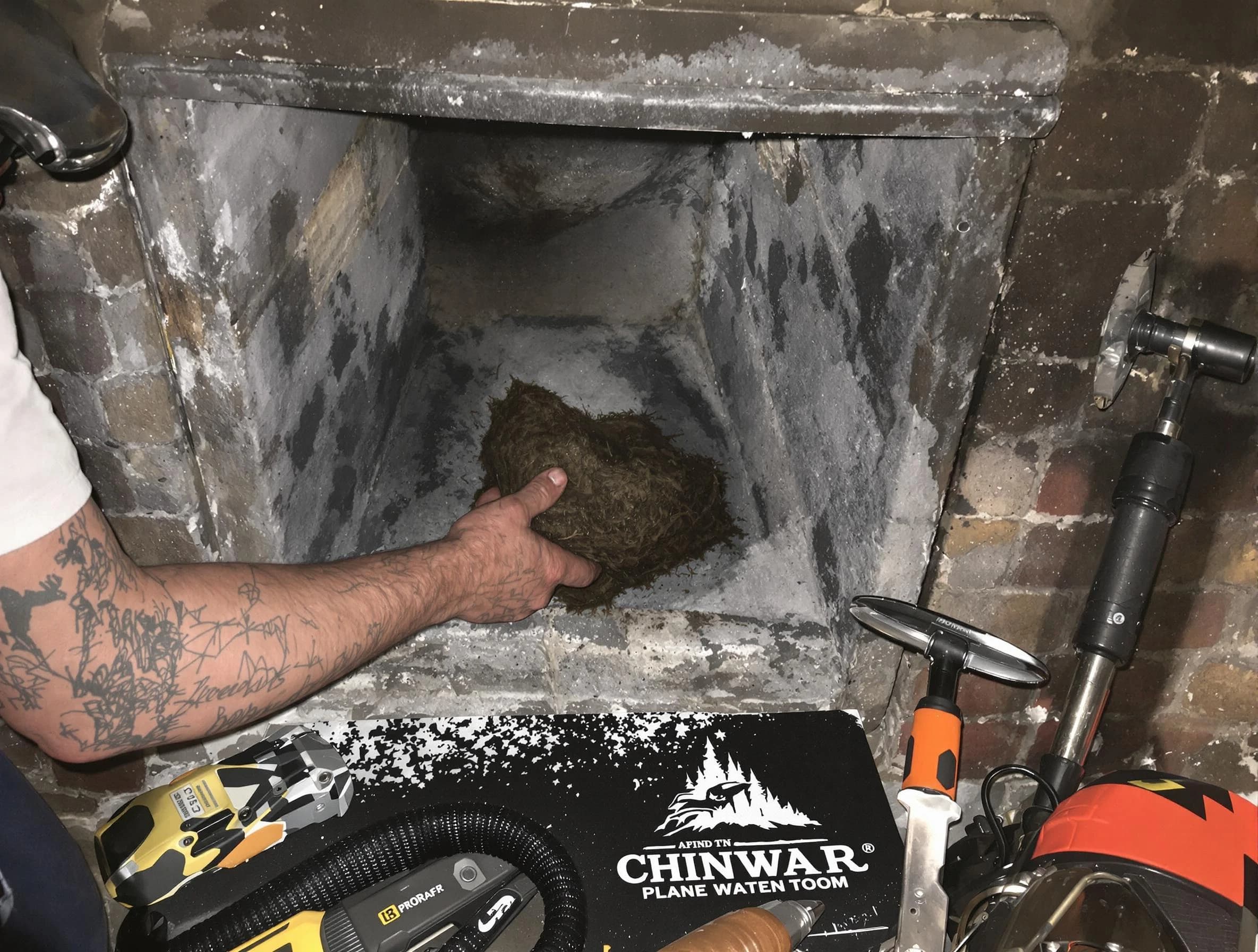 Longmont Chimney Sweep safely removing debris and screening chimney in Longmont, CO